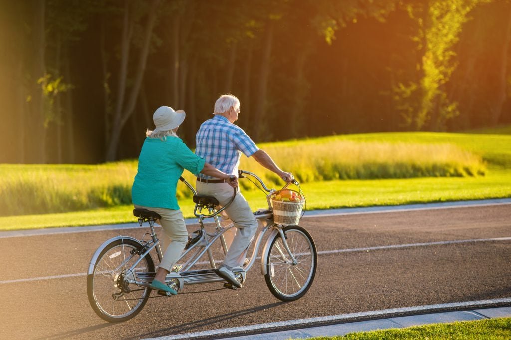 Tandem bike being ridden by a senior couple